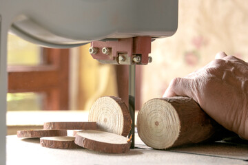 A man carpenter works with a tree in a special car