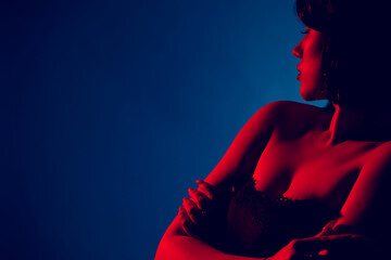 Portrait of a sexy woman in neon lighting. - 431865228