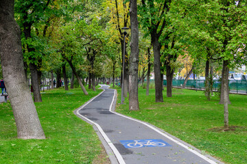 Bike and running lane in Drumul Taberei Park, also known as Moghioros Park, in Bucharest, Romania,...