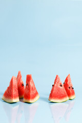 Sliced watermelon on blue background