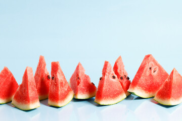 Sliced watermelon on blue background