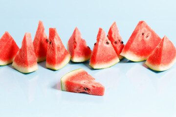Sliced watermelon on blue background