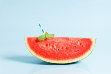 Sliced watermelon on blue background