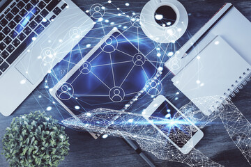 Double exposure of social network theme drawing over table with phone. Top view. People connecting concept.