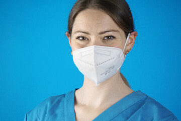 Portrait of a female Doctor in protective clothing with FFP2 mask