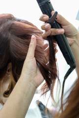 Fototapeta premium Woman's hair being coloring or painted at the hair stylist beauty salon