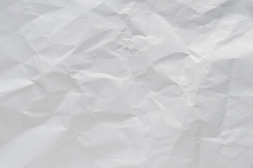 White crumpled paper texture background.