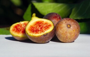 Close up of fresh ripe Tin fruits, Fig fruits, in shallow focus. The Scientific name of this fruits is Ficus carica, a species of flowering plant in the mulberry family, known as the common fig