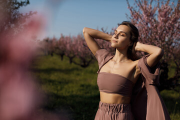 beautiful young woman outdoor in bloom field