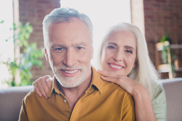 Photo of happy charming old man and woman family smile good mood indoors inside house home apartment