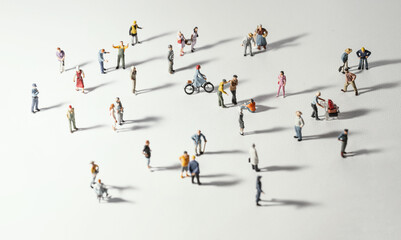 Top view of people (miniature toys) with long shadows keep distance away in public during sunrise or sunset.Social distancing during COVID-19 coronavirus outbreak spreading concept. - obrazy, fototapety, plakaty