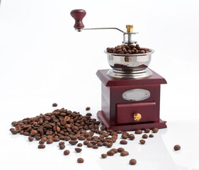 Vintage wooden coffee grinder with coffee bean on white background