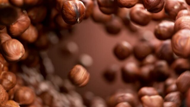 Super Slow Motion Shot of Hazelnuts Making Vortex