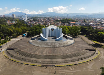 Aerial shoot of Monument to the Struggle (Monumen Perjuangan), Landmark of Bandung, Indonesia. Monument is with Garuda, Indonesia national emblem and motto.