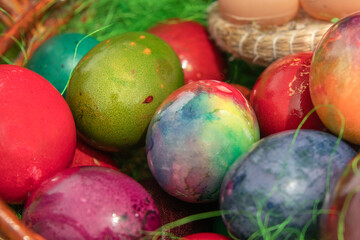 Obraz na płótnie Canvas Close-up of colored Easter eggs in multicolored toppings