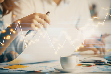 Double exposure of forex graph drawing over people taking notes background. Concept of financial analysis