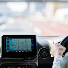 japanese middle aged woman using car navigation system