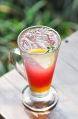 lemon soda or tonic, soda and lime slice