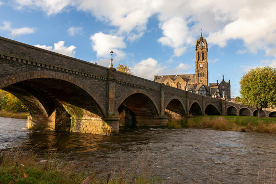 The river Tweed at Peebles, showing the Tweed Bridge and the Old Parish Church, Scottish Borders, UK