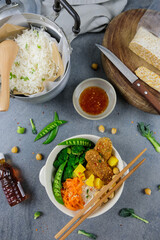 Homemade Thai vegetarian meal / Thai Sweet Chili Tempeh Buddha Bowl Bento / Delicious and healthy meal for light eater and weight watcher for a clean living lifestyle