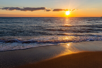 Fototapeta na wymiar Sunset over the tropical sea.