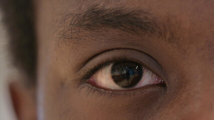 Close Up of Blinking Eyes of Young African Man