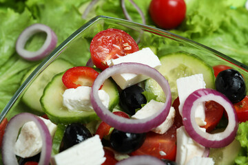 Bowl of delicious greek salad, close up