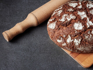 Homemade bread on a on rustic background copy space.