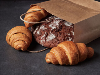 Homemade bread on a on rustic background copy space.