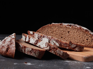 Homemade bread on a on rustic background copy space.