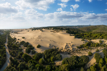 Aerial view with grazing light of the sand dunes of Piscinas in western Sardinia