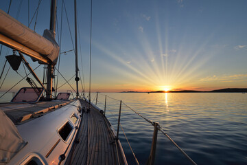 Mediterranean Sea - Anchoring in the sea at sunset on a sailing boat in Sardinia