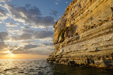 ITALY - Sardinia - Sunset view of the cliffs of Roia de Su Cantaru along the coast of the Sinis peninsula on the west coast of Sardinia