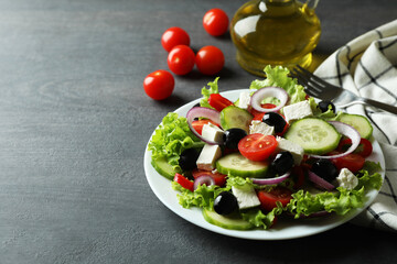 Plate of greek salad on dark wooden background