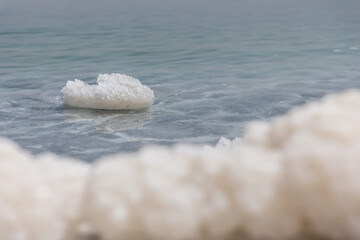 Fototapeta na wymiar Dead sea salt crystals on the water