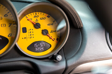Low Level fuel warning light in car dashboard.