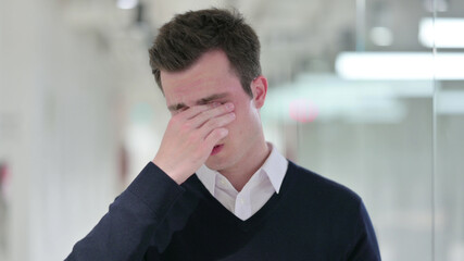 Exhausted Young Businessman Rubbing Eyes, Tired
