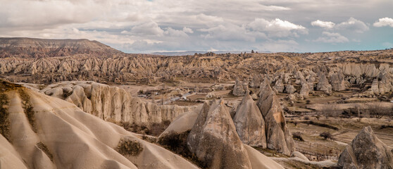 Panorama view of fairy chimneys and typical rock formations near Göreme, Cappadocia, Turkey