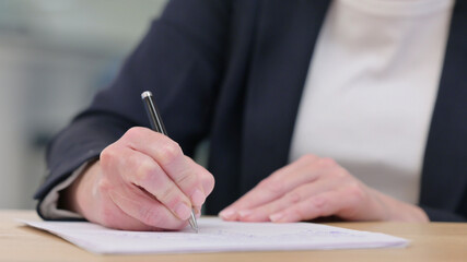 Close up of Female Hand Writing on Paper