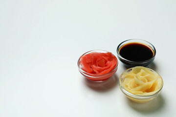 Pickled ginger and soy sauce on white background