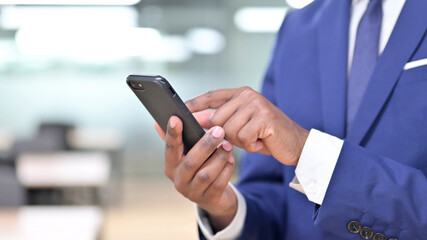 African Businessman Using Smartphone, Text Messaging