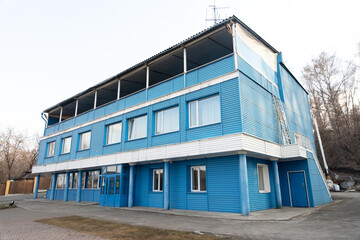 old blue three-story building