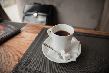 a cup of coffee on a table in a cafe