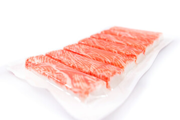 crab sticks in packaging on a white background.