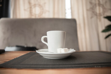 a cup of coffee on a table in a cafe