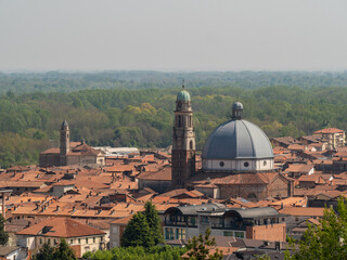 Ancient Saint Peter church and buildings with red tile roofs in Gattinara, Italy