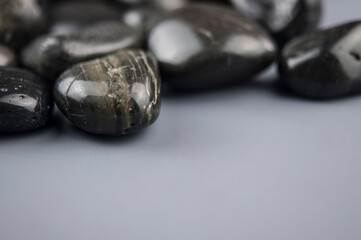 row zen stones on gray paper background