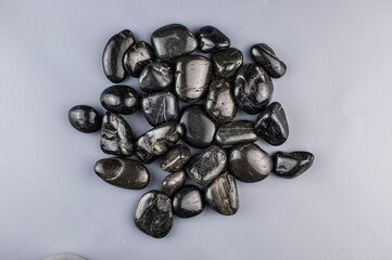 row zen stones on gray paper background