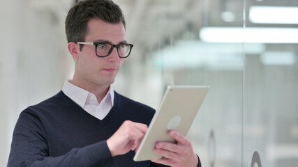 Young Businessman using Digital Tablet, Email