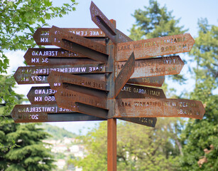 Signs indicating the distance from Como lake to lakes around the world.Cernobbio, Como lake, Italy